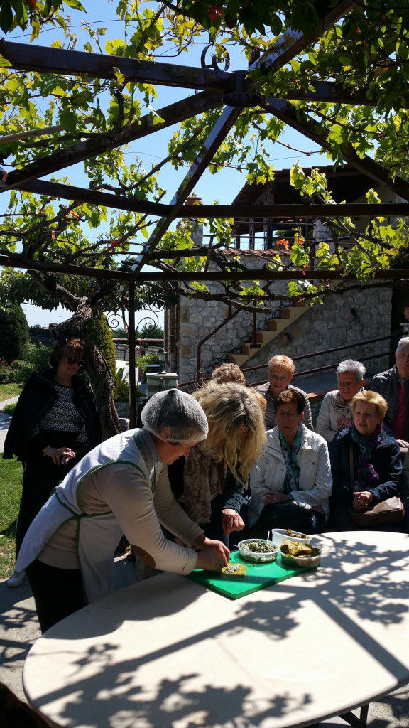 group of women cooking Greek dolmades at 'Marianna' outside